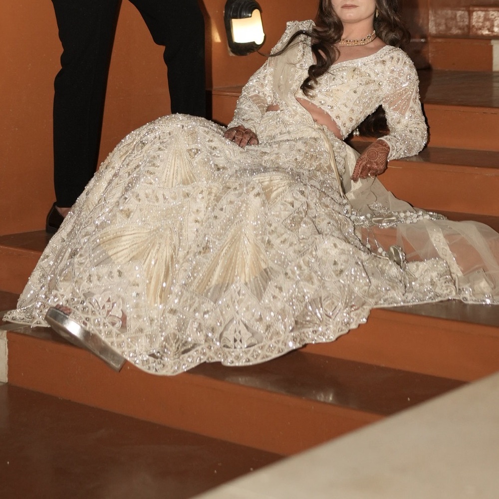 White heavily embroidered lehenga